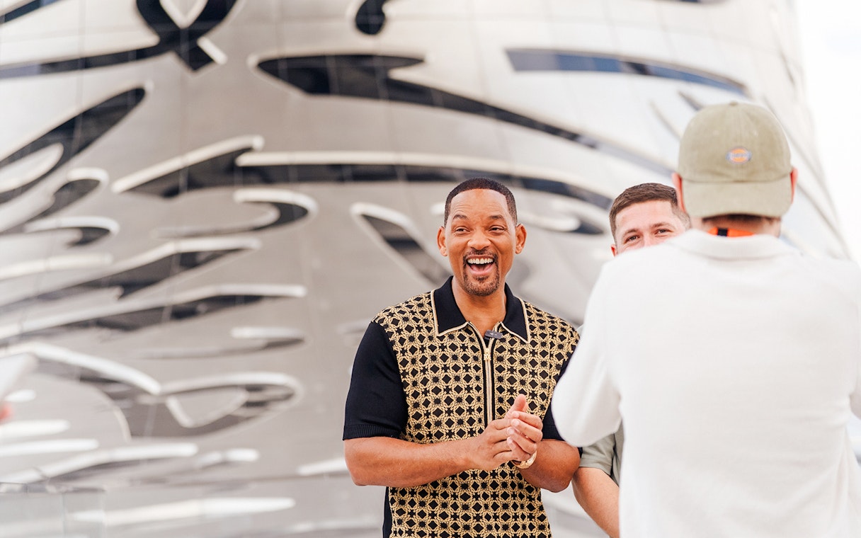 Visitors outside the Museum of the Future in Dubai, featuring its iconic architectural design.