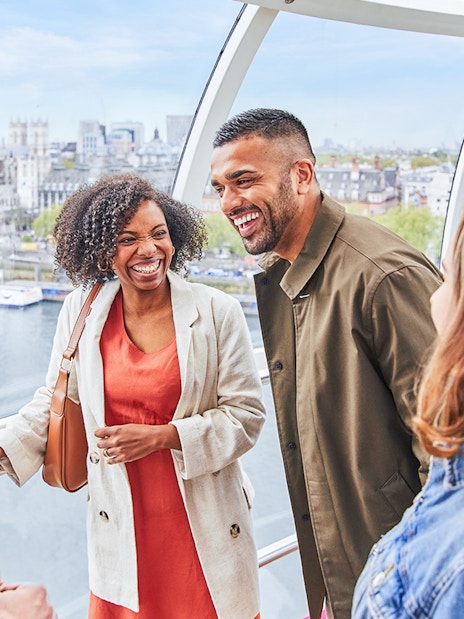 Group enjoying view of Big Ben from London Eye capsule.