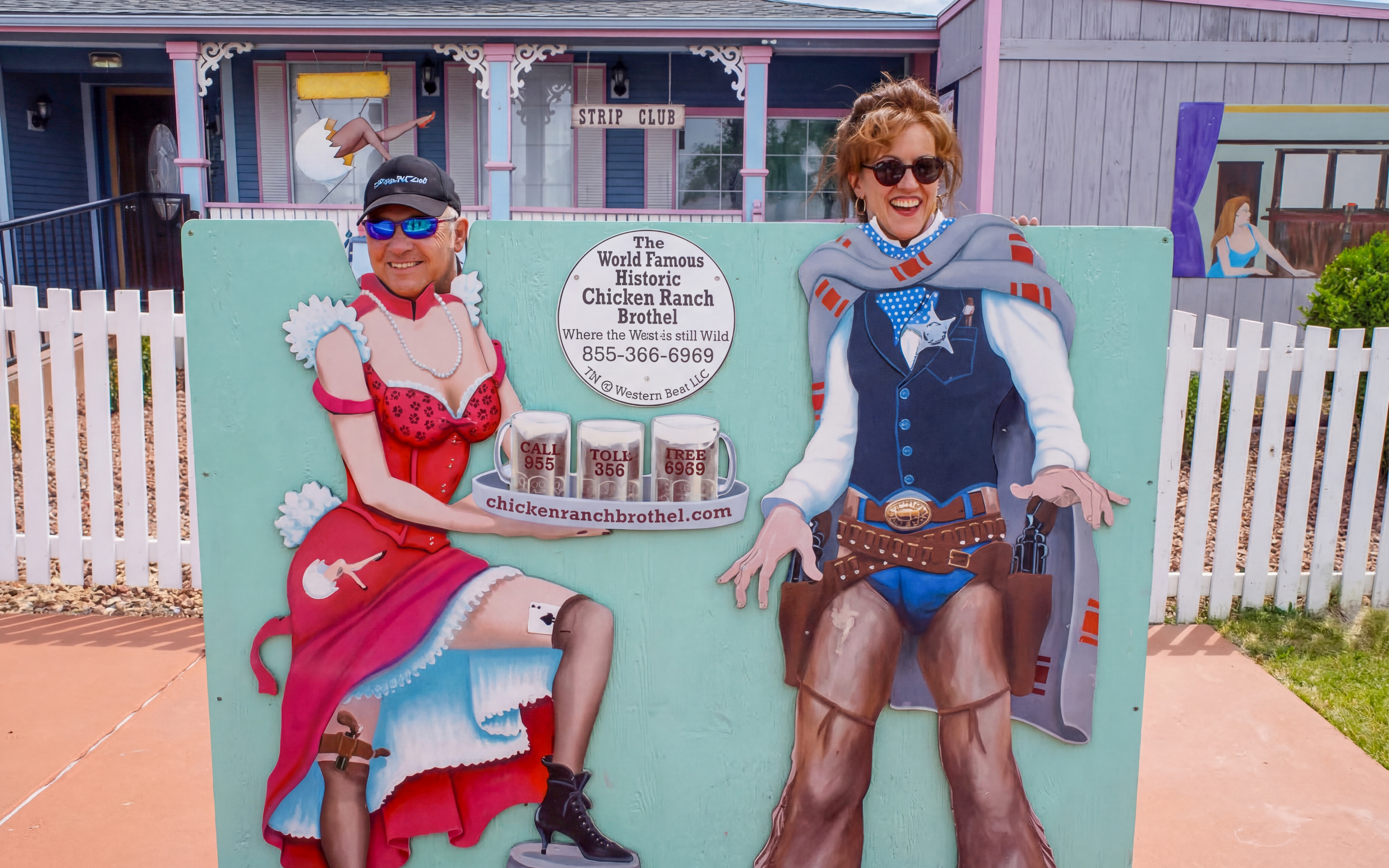 Guests posing with cutout at Chicken Ranch, Nevada.