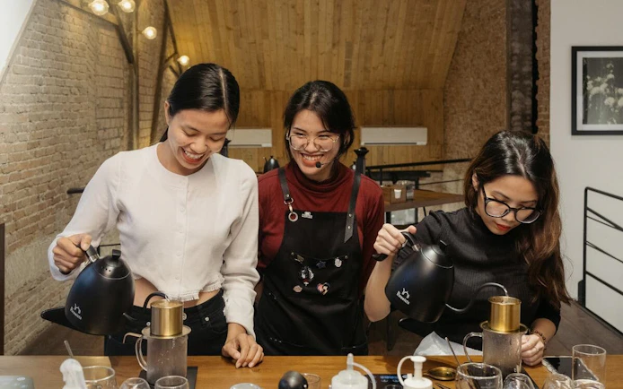 Vietnamese coffee workshop with participants brewing coffee.