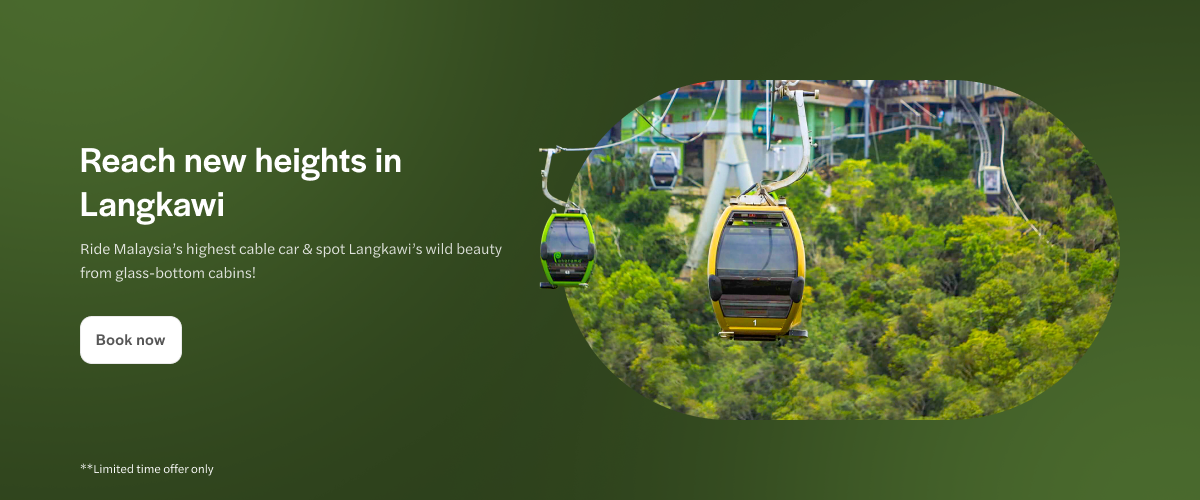 Langkawi cable car over lush forest with glass-bottom cabins.