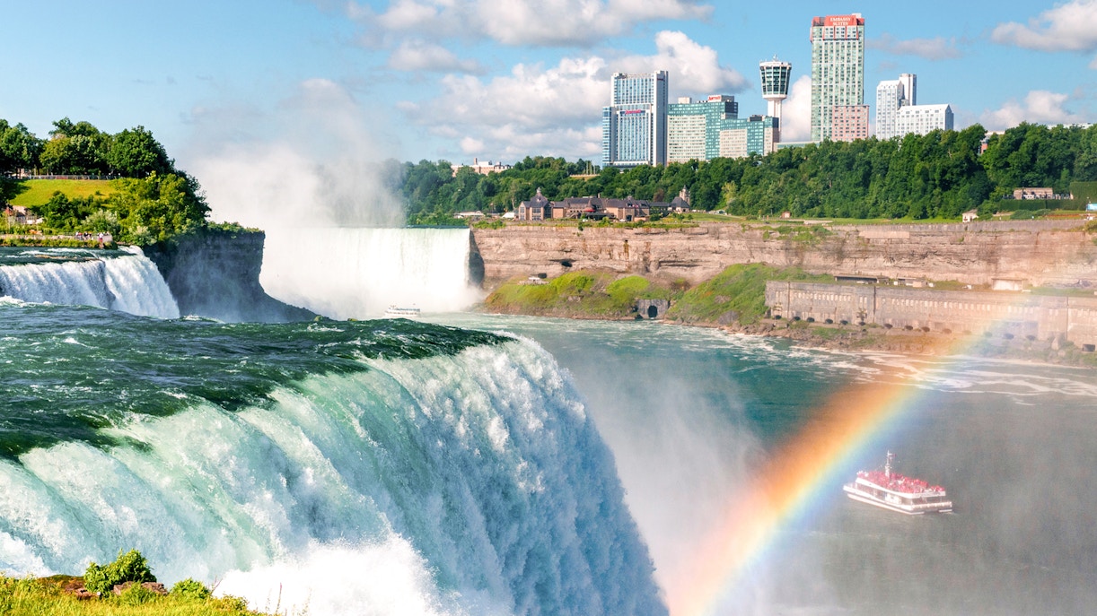 Niagara Falls boat tour with mist and rainbow, Canada.