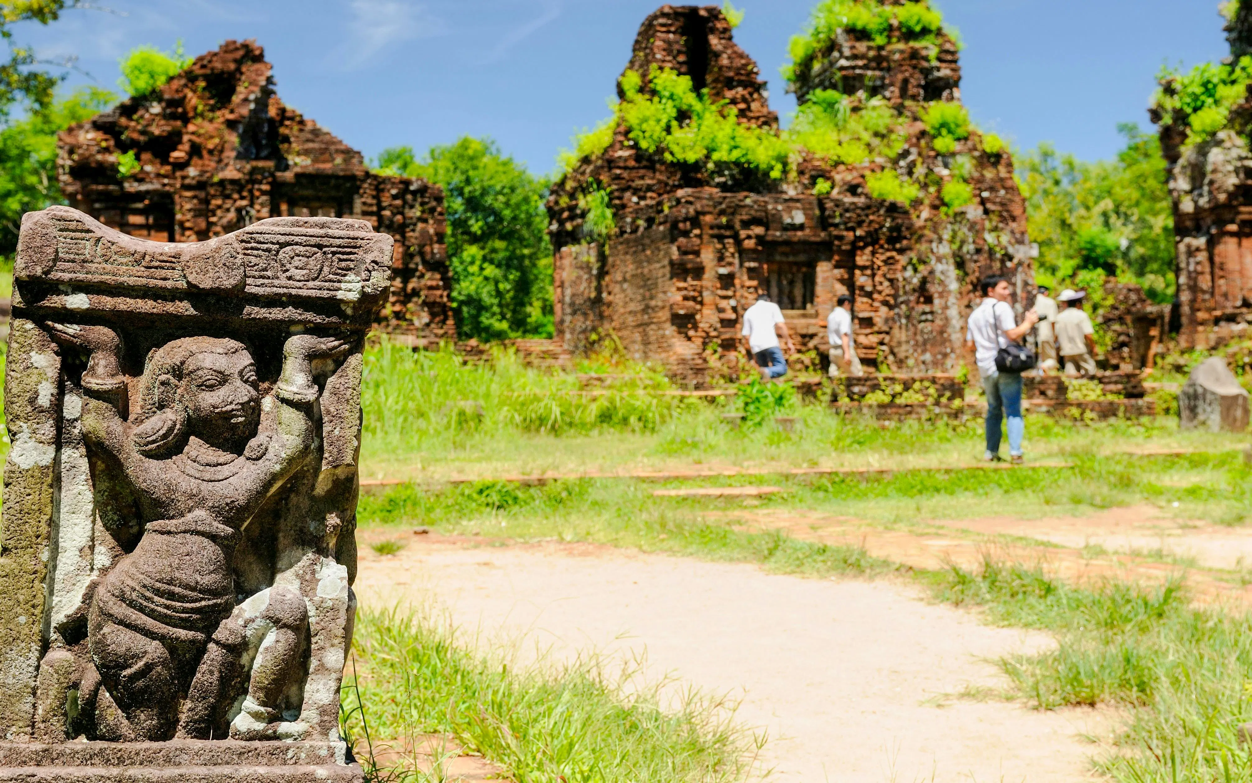 Ancient stone sculpture and temple ruins at My Son Sanctuary, Vietnam.