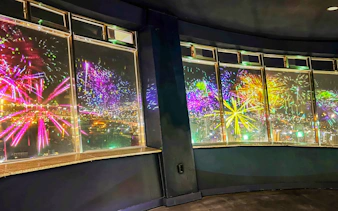 Fireworks display viewed from Busan Tower observatory at night.