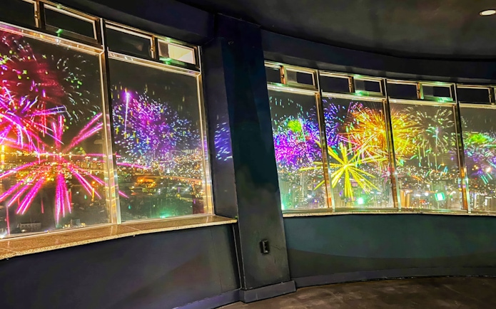 Fireworks display viewed from Busan Tower observatory at night.