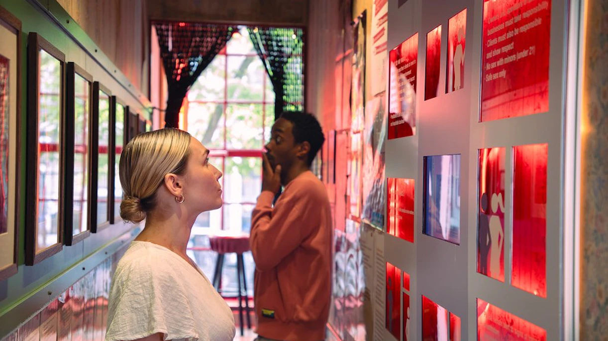 Visitors exploring exhibits at Red Light Secrets Museum in Amsterdam.