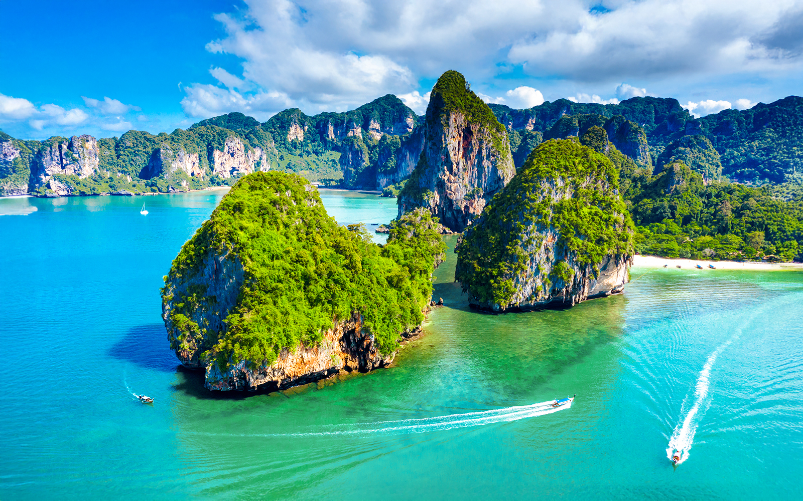 Aerial view of Phra Nang Cave Beach, Krabi, showcasing limestone cliffs and turquoise waters.