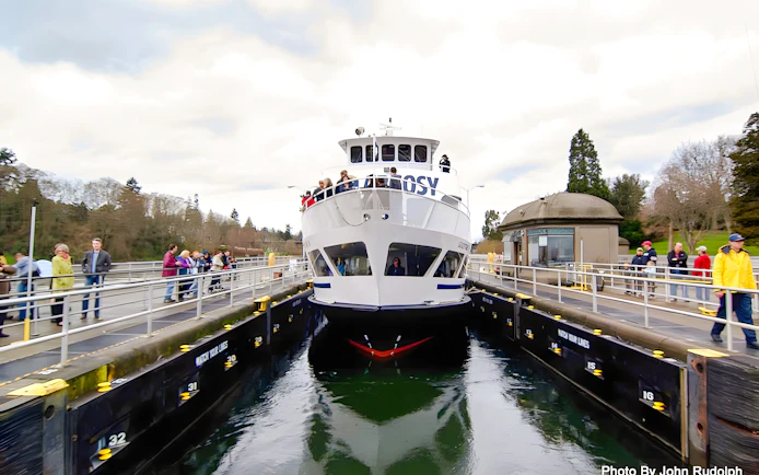 Argosy Cruises vessel at Seattle Locks with passengers on deck.
