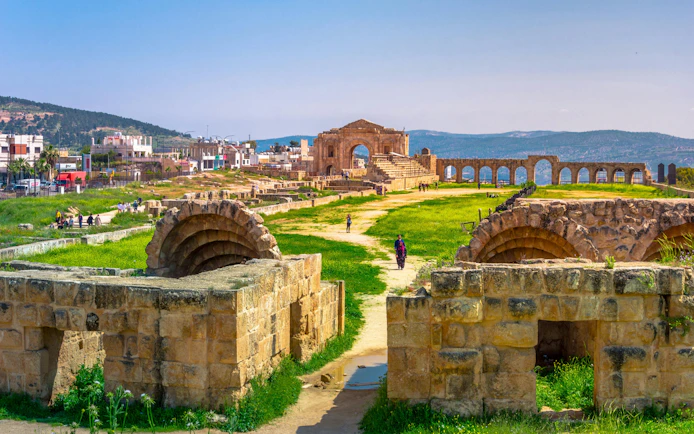 Ancient Roman ruins of Jerash Gerasa, Jordan with stone arches and pathways.