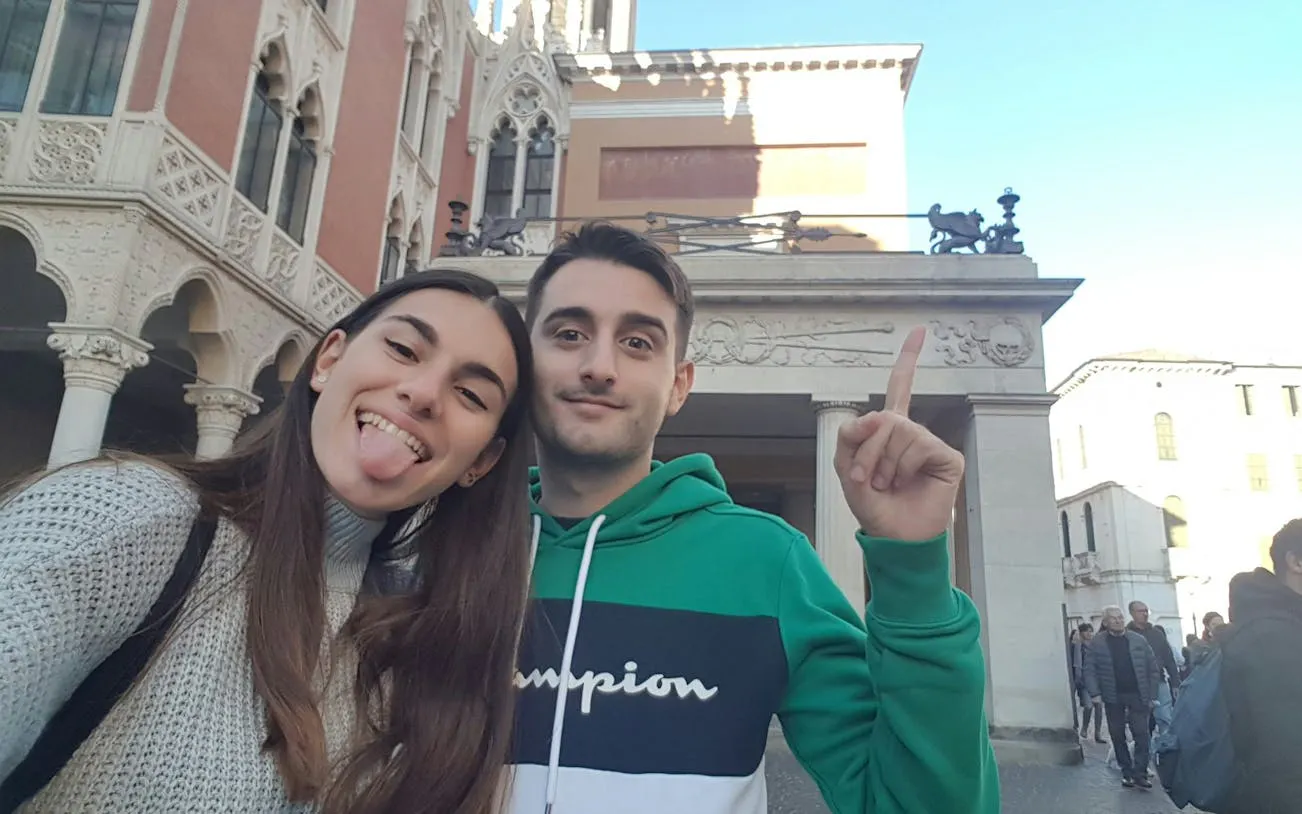 Couple exploring historic architecture in Padua during self-guided city game.
