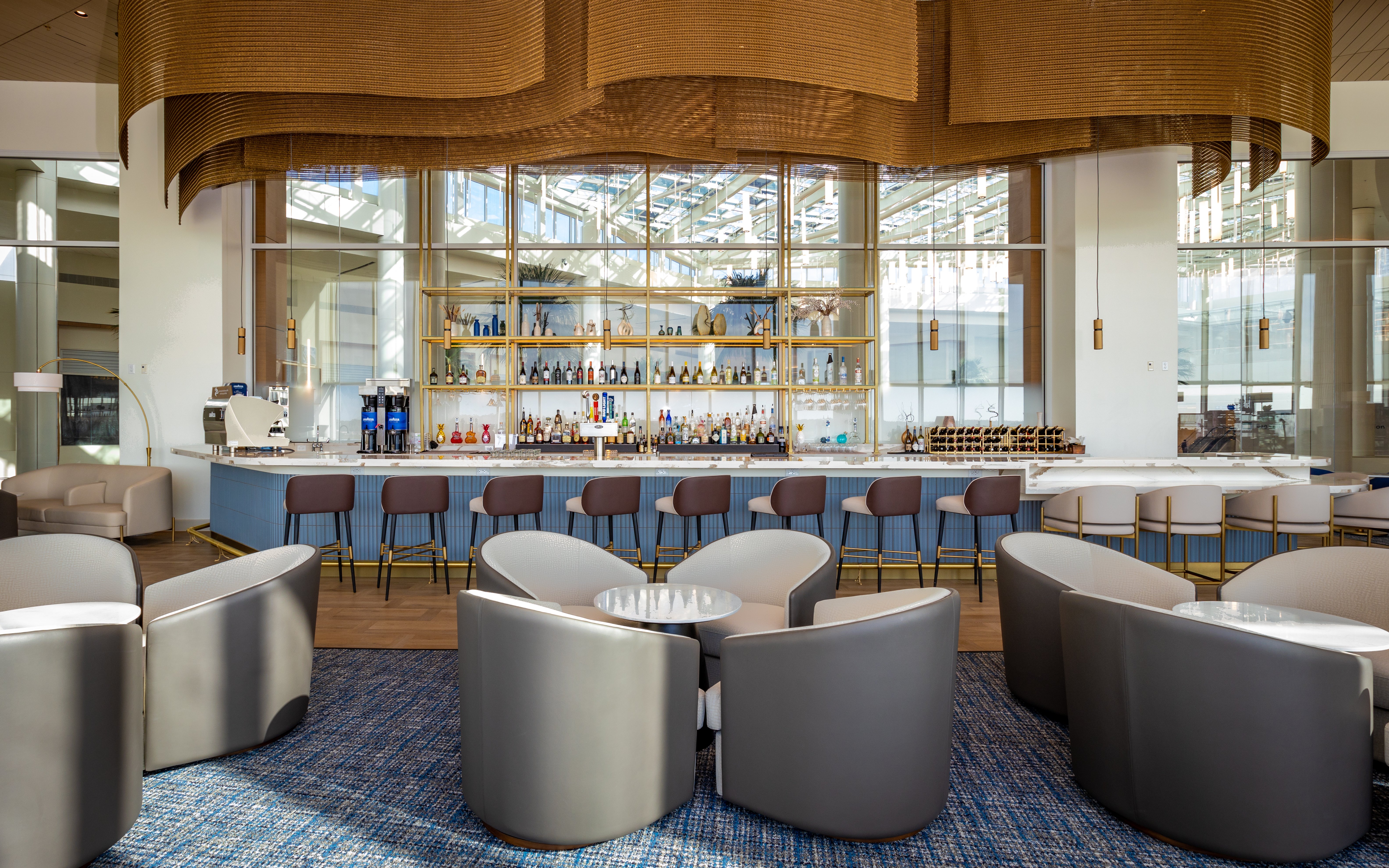 Bar seating area at Plaza Premium Lounge, Orlando Airport Terminal C.