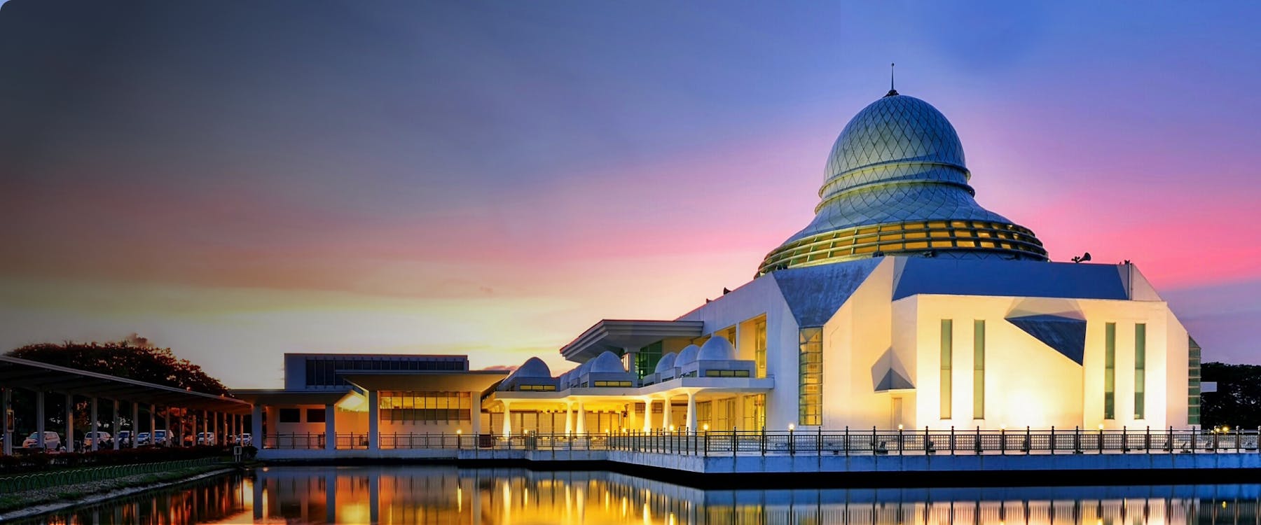 Modern mosque with a dome at sunset in Perak, Malaysia.