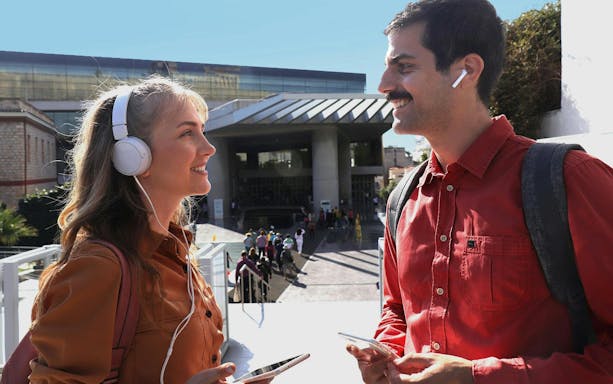 Visitors with audio guides outside Acropolis Museum, Athens.