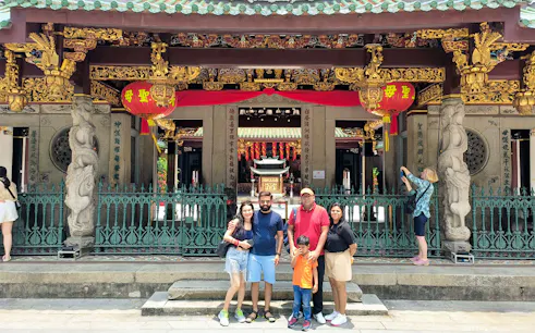Family posing in front of Thian Hock Keng Temple during Singapore City Tour.