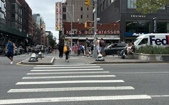 Katz's Delicatessen exterior on a busy New York street, part of Broadway Whodunit game.