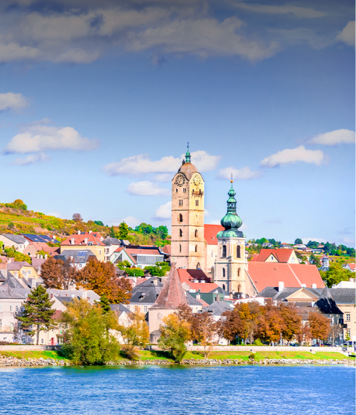 Krems an der Donau skyline with church towers, Wachau Valley, Danube River, autumn landscape.