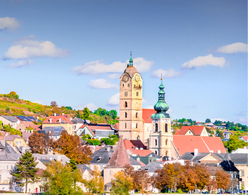 Krems an der Donau skyline with church towers, Wachau Valley, Danube River, autumn landscape.
