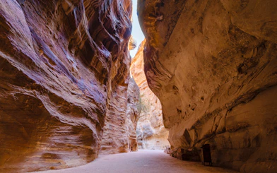 Sandstone walls of the Siq canyon in Petra, Jordan, leading to ancient city.