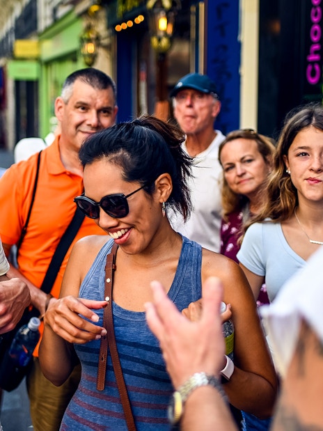 Group enjoying a guided food tour in Montmartre, Paris.