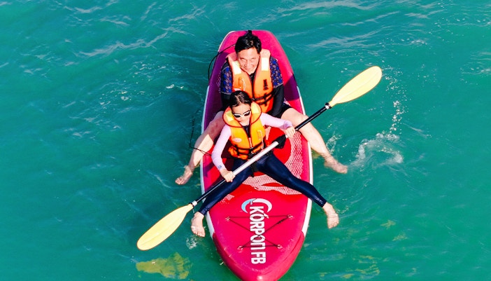 People kayaking at Yona Beach Club