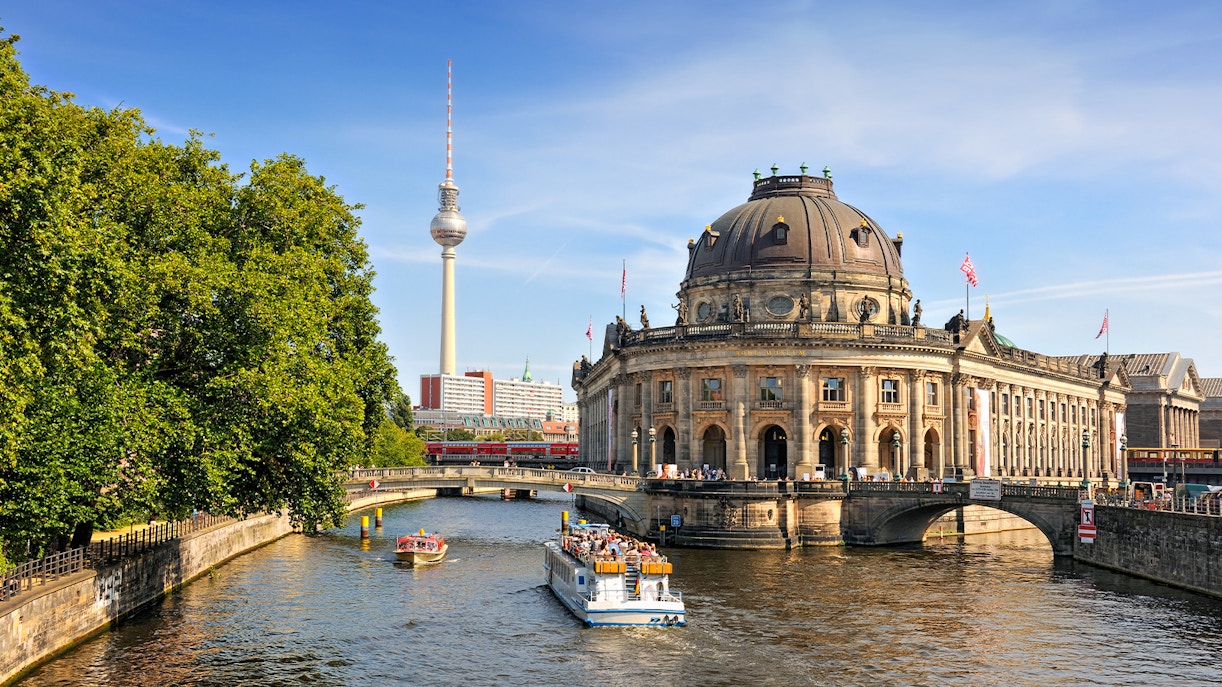 Spree river cruise passing Museum Island with Berlin TV Tower in the background.
