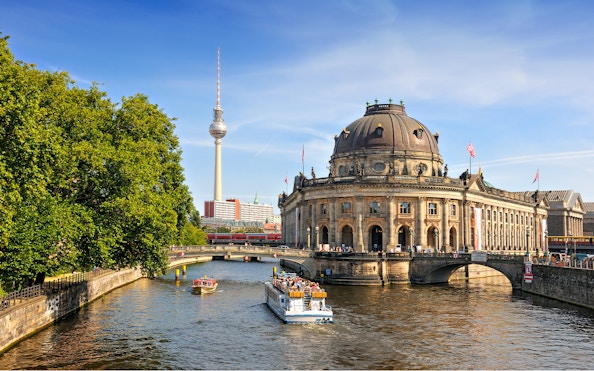 Spree river cruise passing Museum Island with Berlin TV Tower in the background.
