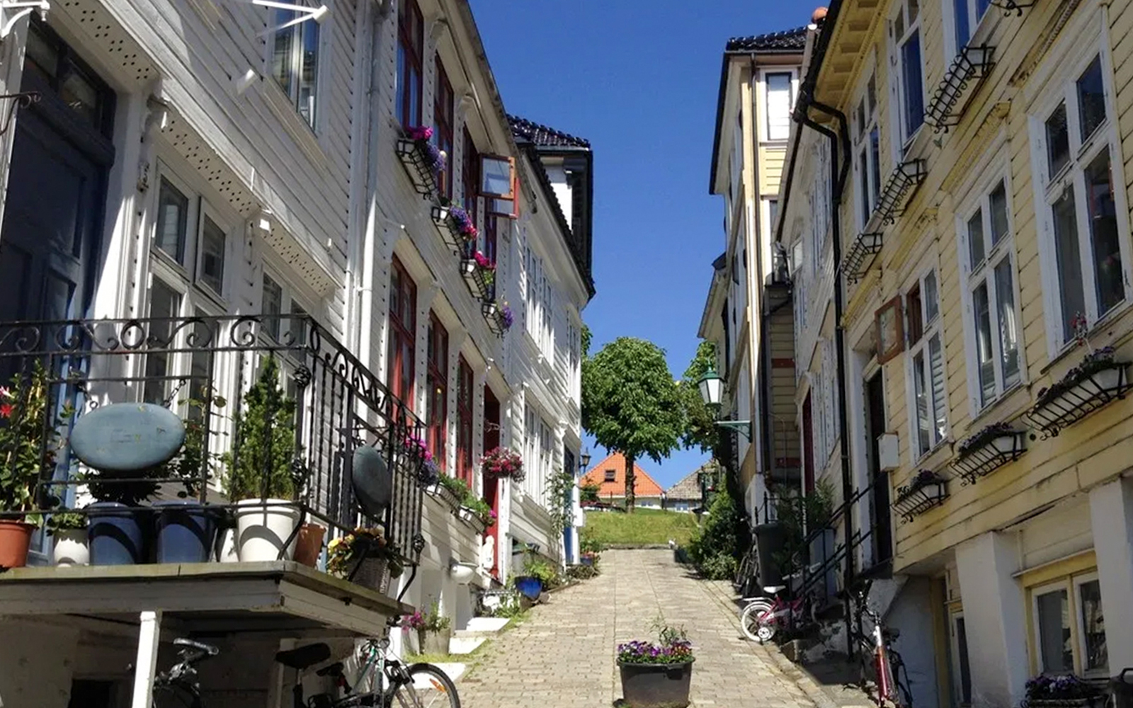 Steep cobblestone alleyway in Strangebakken, Nordnes neighborhood, Bergen, Norway.