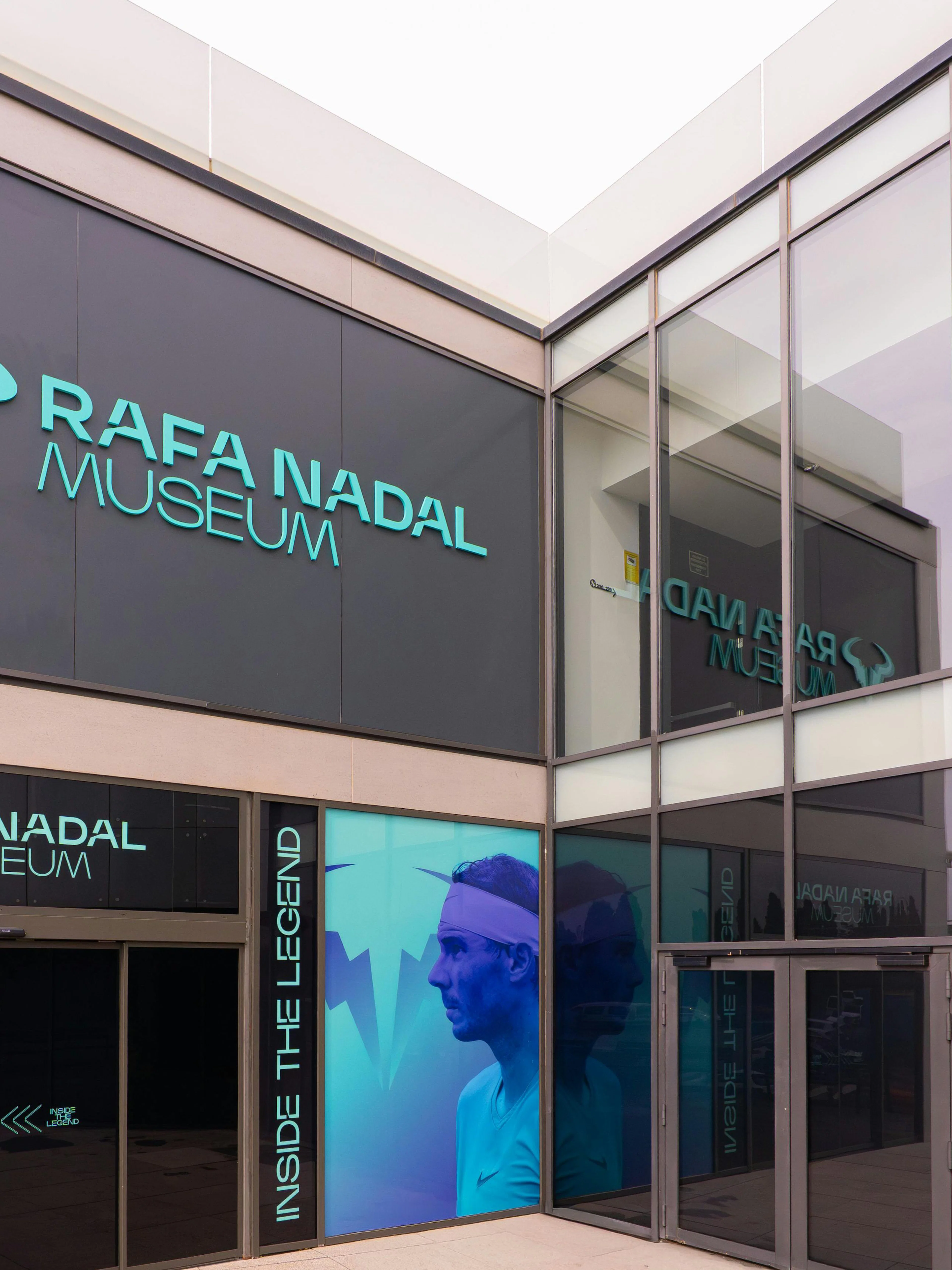 Rafa Nadal Museum entrance with large signage and glass facade.