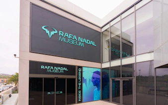 Rafa Nadal Museum entrance with large signage and glass facade.