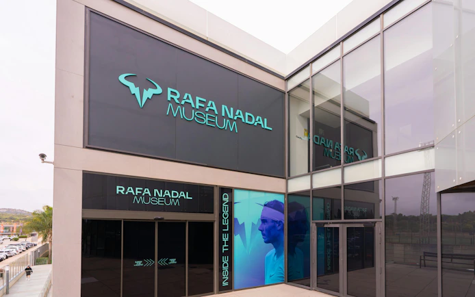 Rafa Nadal Museum entrance with large signage and glass facade.