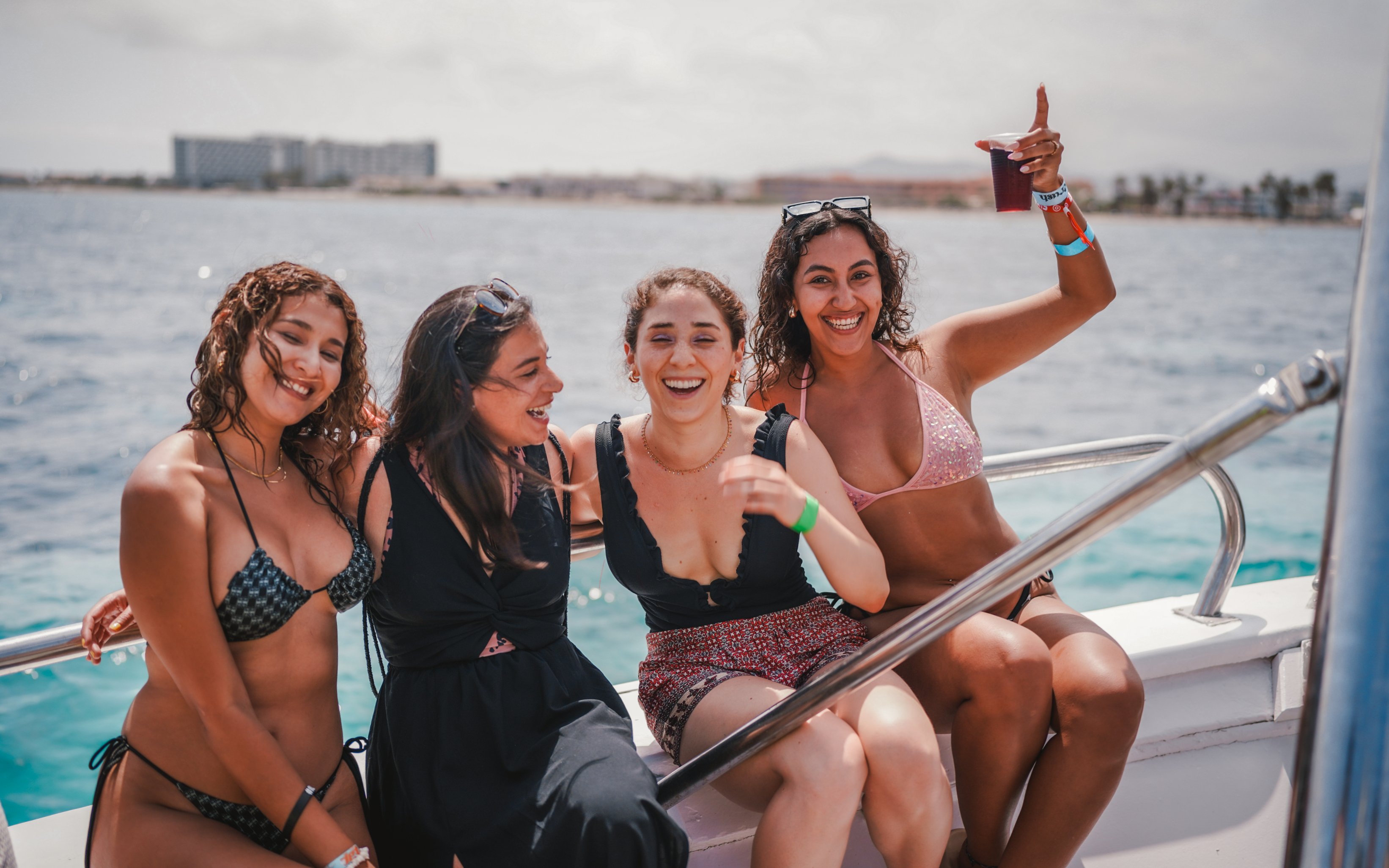 Tourists enjoying Cruise Crush Boat Party on the ocean.