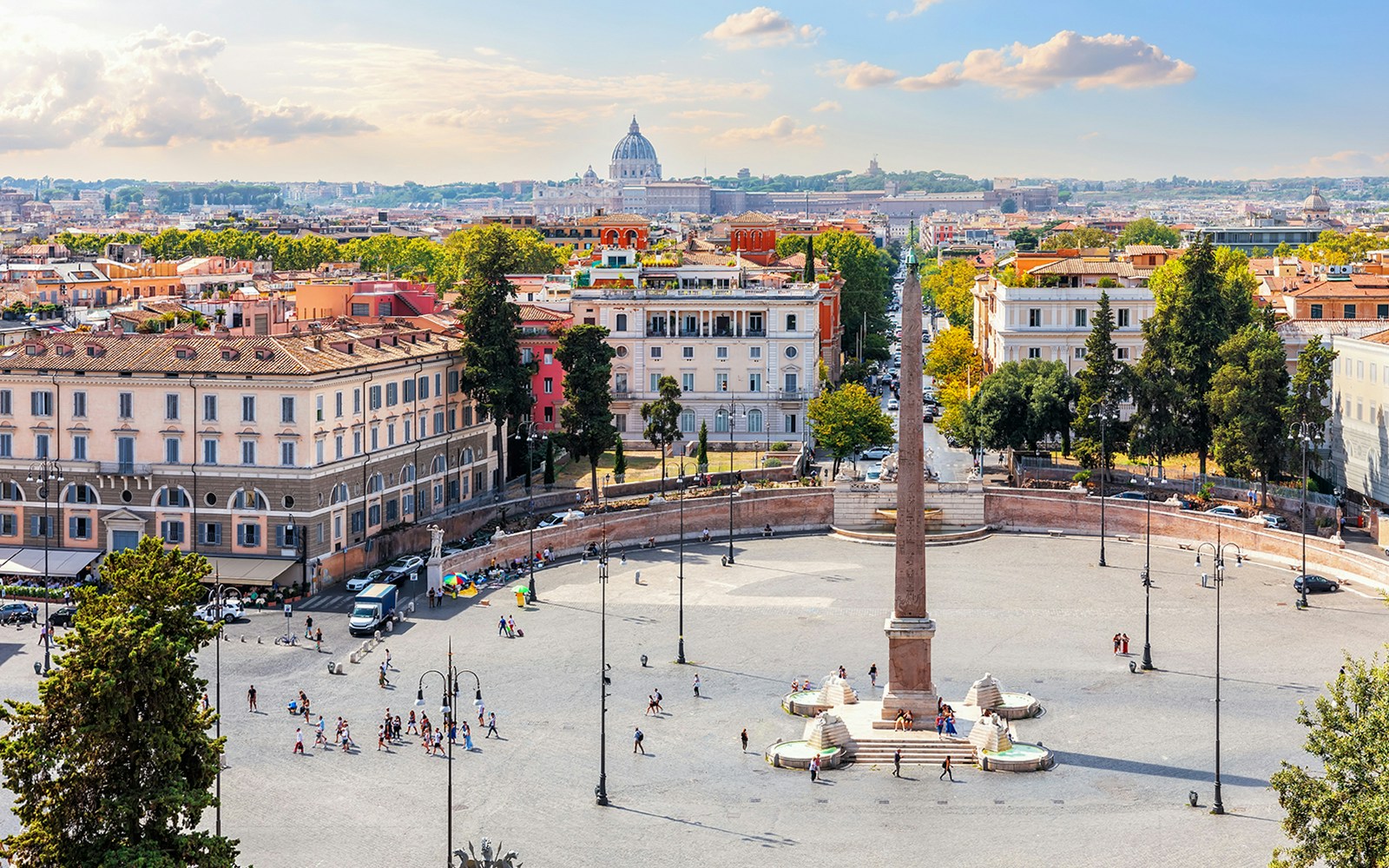 Egyptian Obelisk and fountains in Piazza del Popolo, Rome, with cityscape.