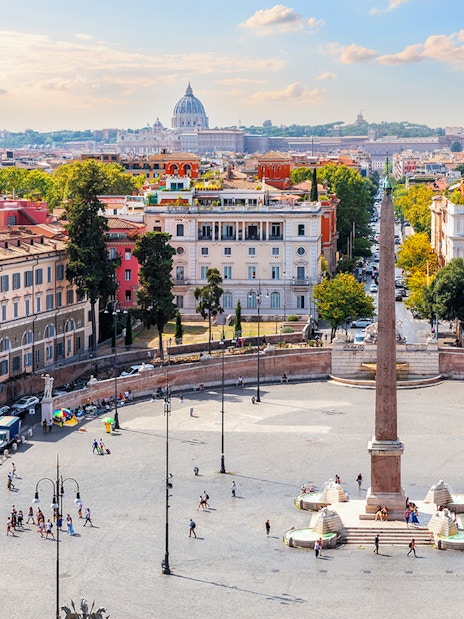 Egyptian Obelisk and fountains in Piazza del Popolo, Rome, with cityscape.