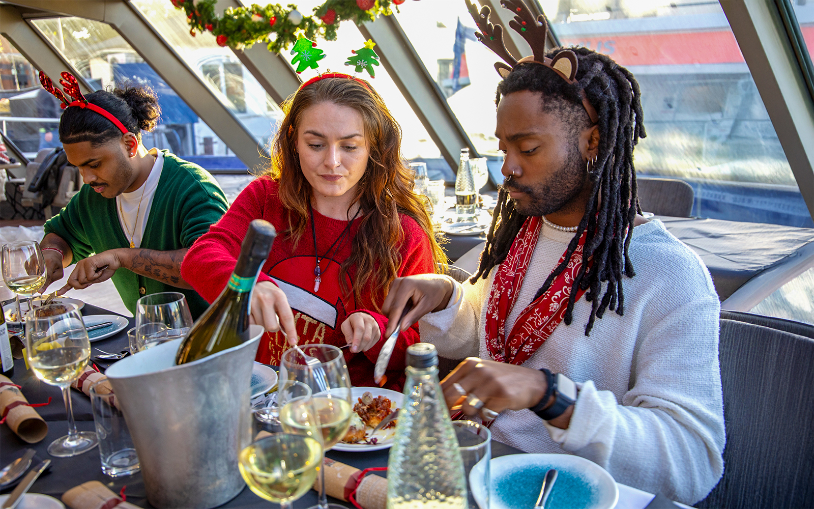Guests enjoying Christmas lunch on a Thames River cruise.