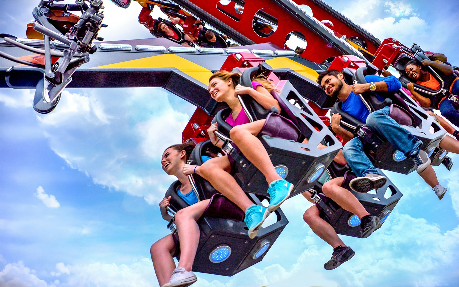 Riders enjoying the CATWOMAN™ Whip ride at Six Flags Over Texas.