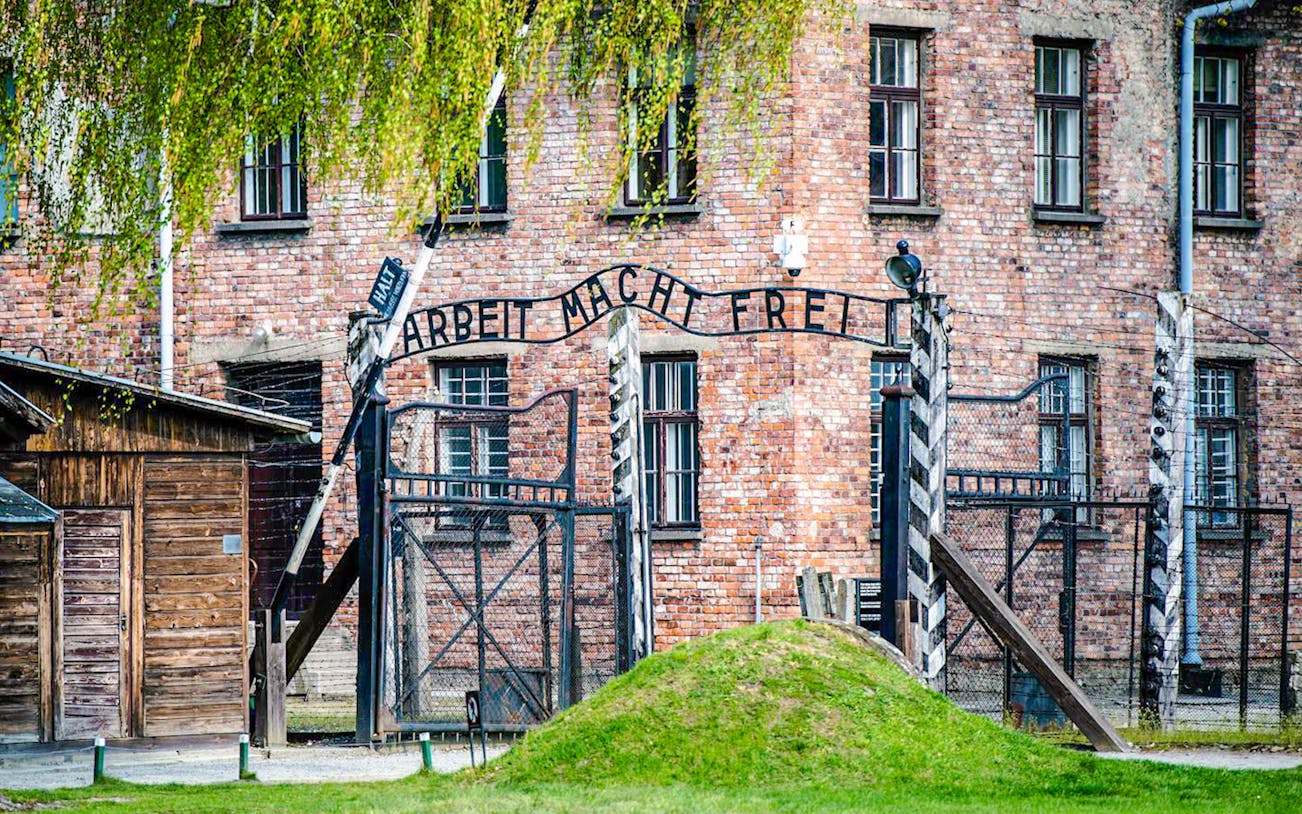 Auschwitz I entrance gate with "Arbeit Macht Frei" sign, Poland.