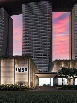 IMBA Theatre entrance with modern architecture in Singapore at sunset.