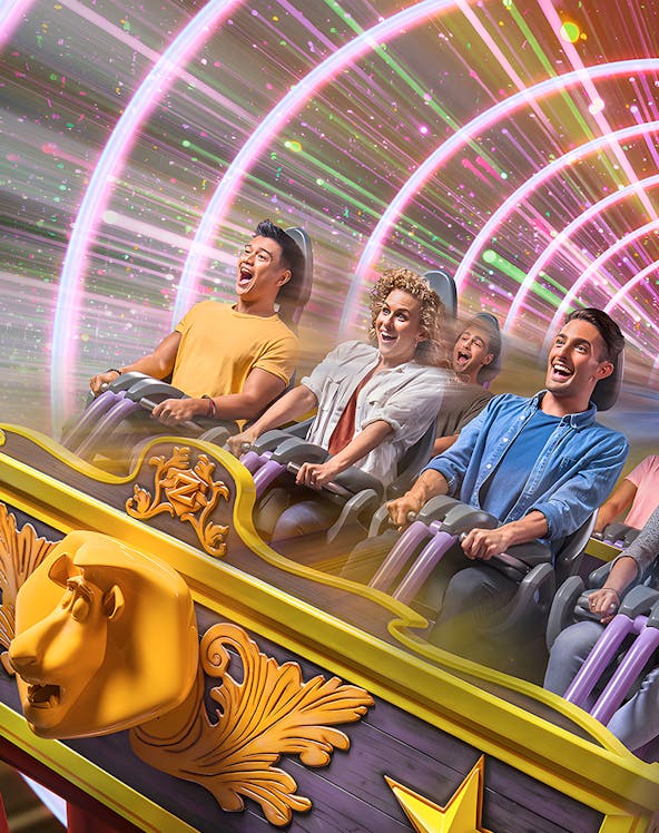 People enjoying a thrilling roller coaster ride with colorful light tunnel.