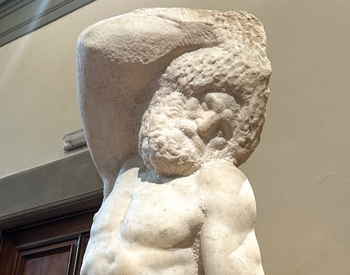 Bearded Slave sculpture at Accademia Art Gallery, Florence, Italy.