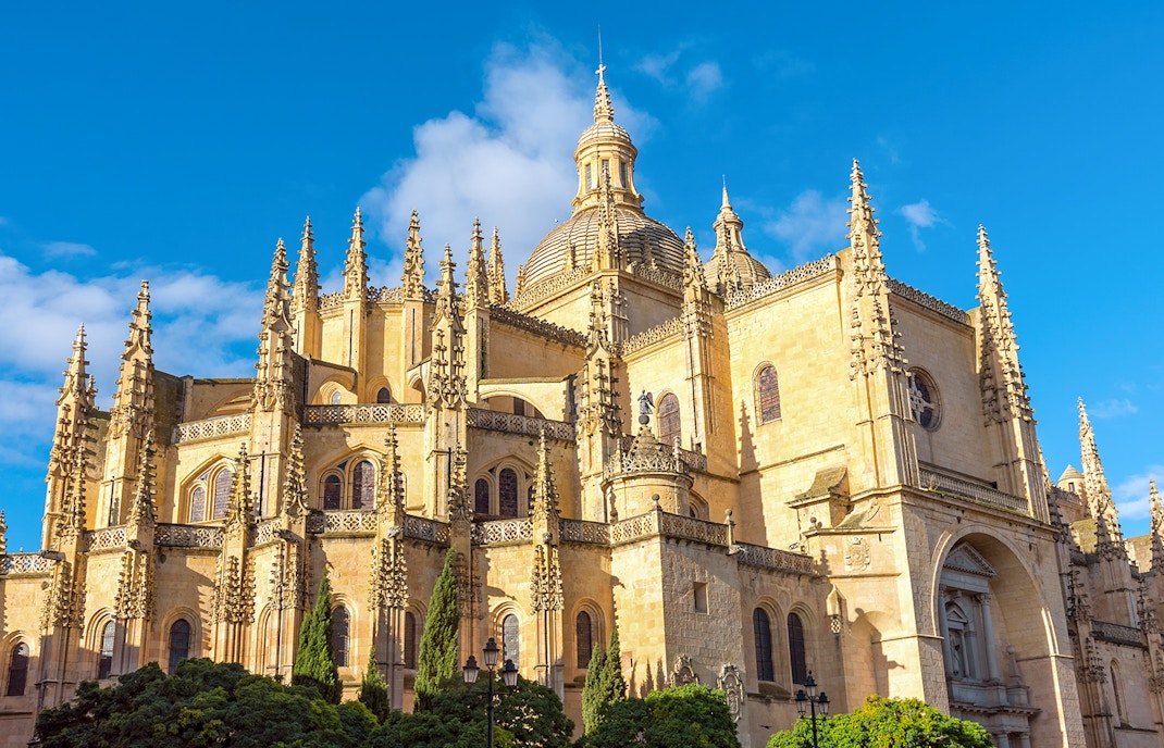 Cathedral of Segovia, Spain, showcasing Gothic architecture with spires and domes.