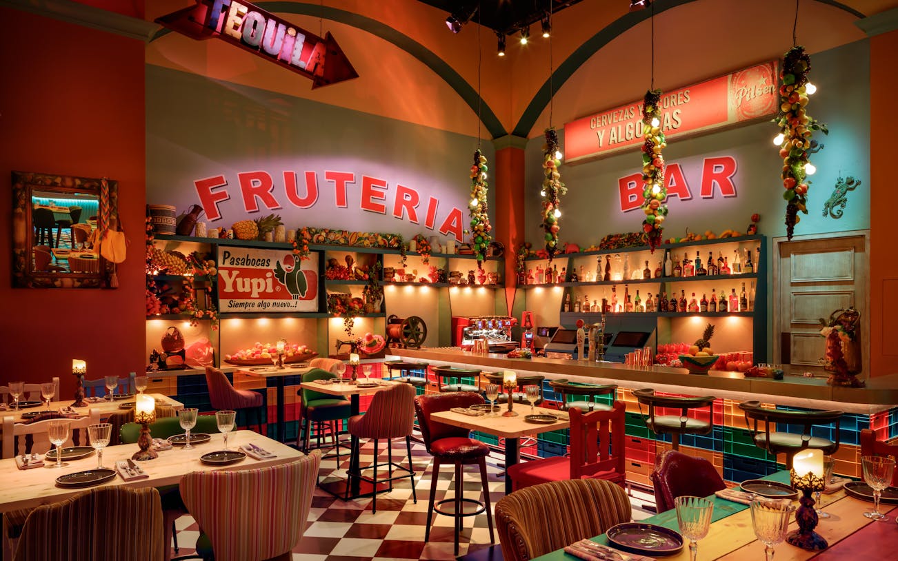 Mexican-themed brunch setup with colorful decor and bar at En Fuego Fiesta Mexicana, Dubai.