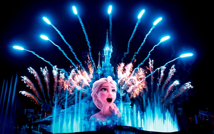 Frozen Elsa projection on Sleeping Beauty Castle with fireworks, Disneyland Paris.