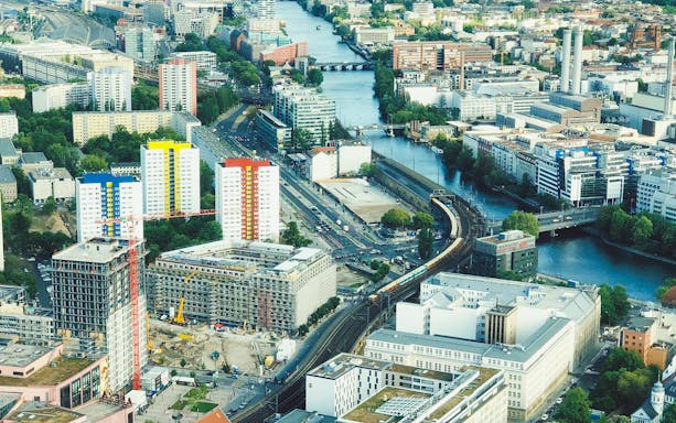 Aerial view of Berlin cityscape with colorful buildings and Spree River from the TV Tower.