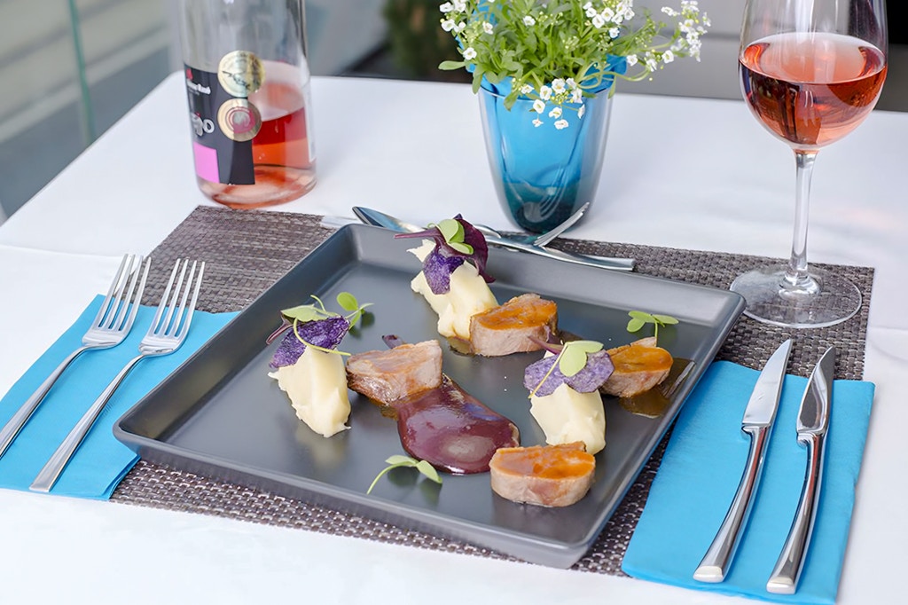 Indoor dining area with tables set for meals at Rudas Bath restaurant, Budapest.