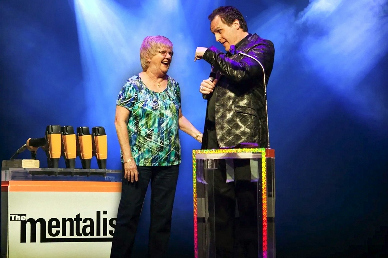 Performer interacting with audience member during The Mentalist show.