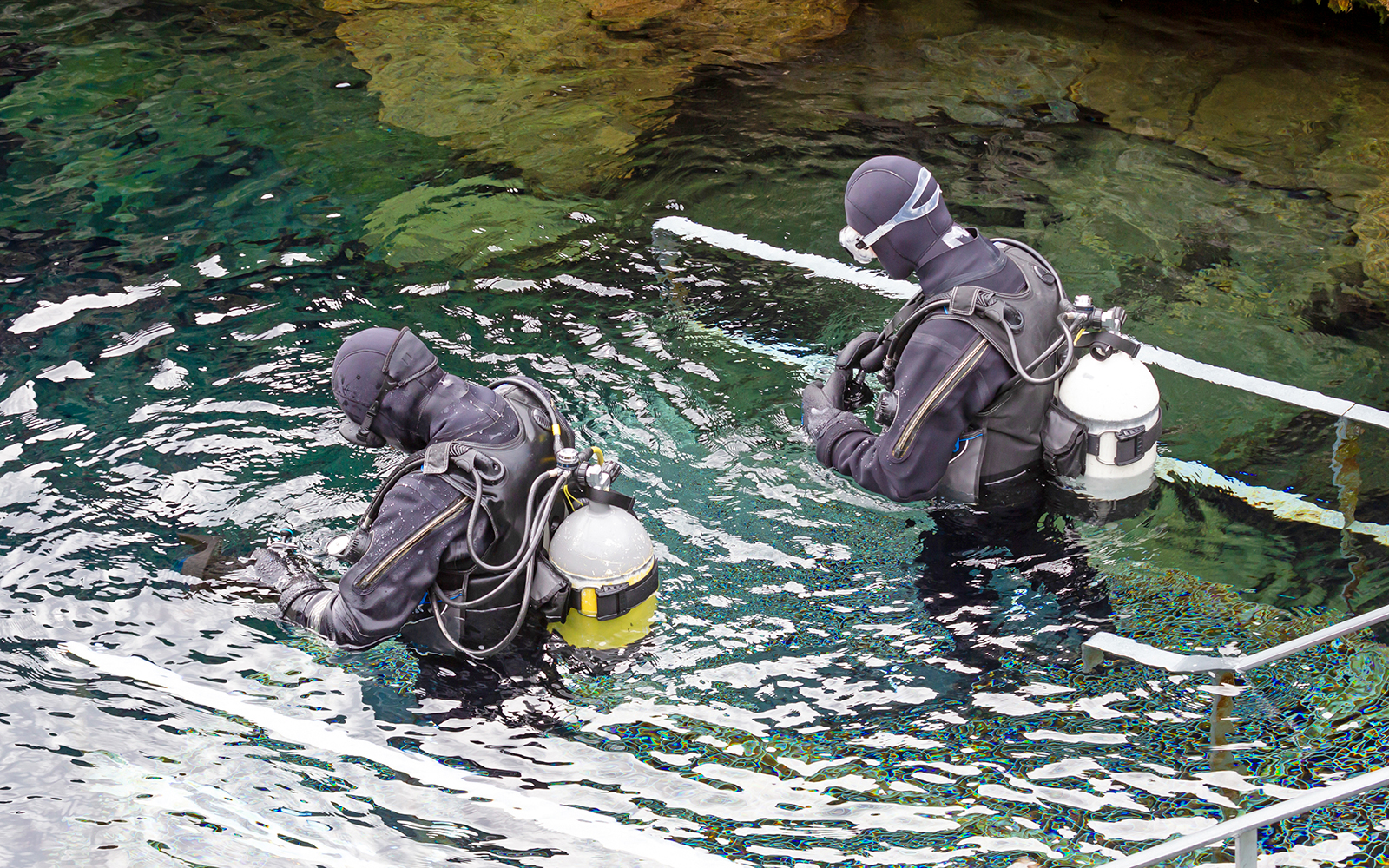 Snorkelers entering Silfra Fissure in Iceland.