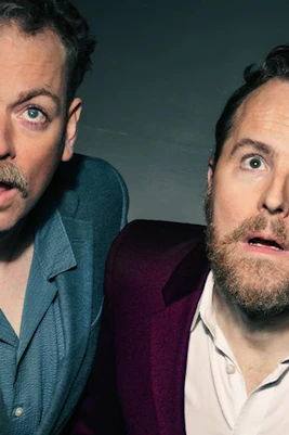 Two men looking surprised with the text "It's Headed Straight Towards Us" in bold letters.