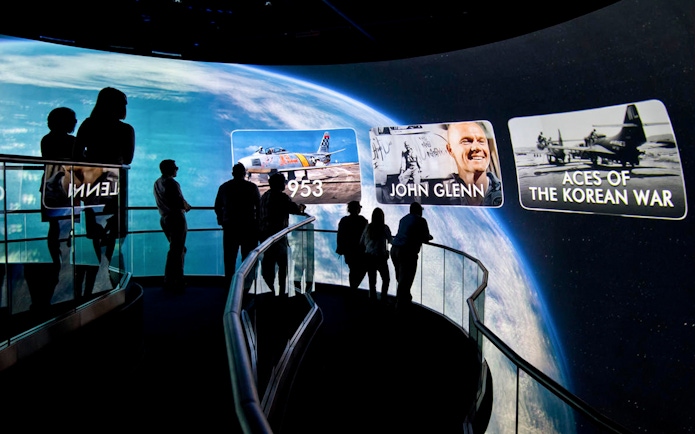 Visitors viewing space and aviation displays at the Heroes and Legends Exhibit, Kennedy Space Center.