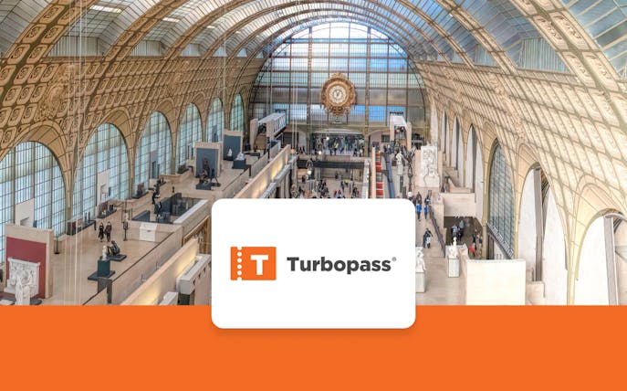 Interior view of Musée d'Orsay in Paris, showcasing art exhibits and architecture.