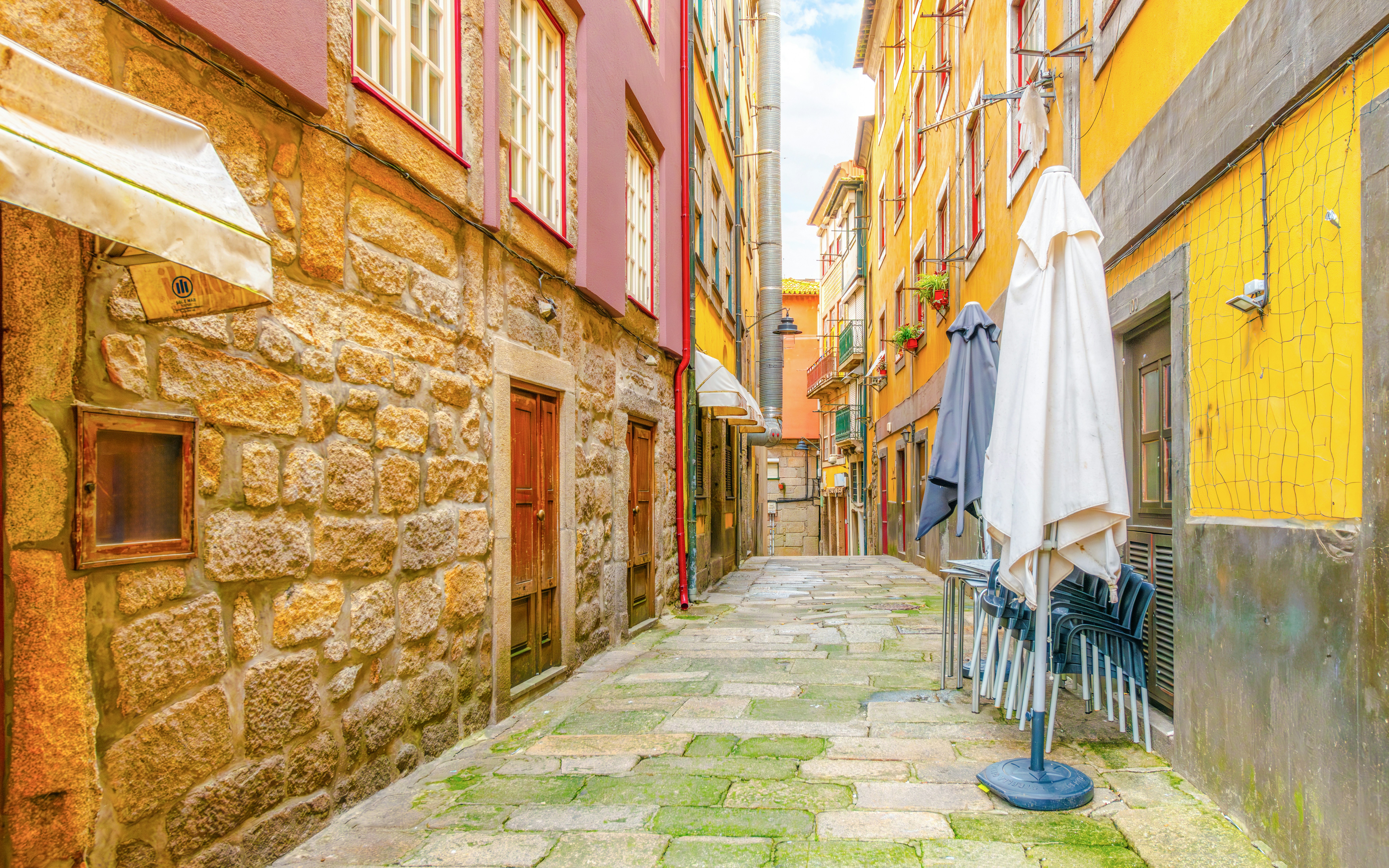 A narrow, colorful hillside alleys in the historic Ribeira district of Porto